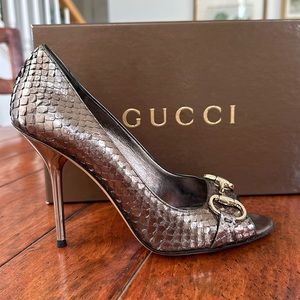 Gucci snakeskin peep toe heels.